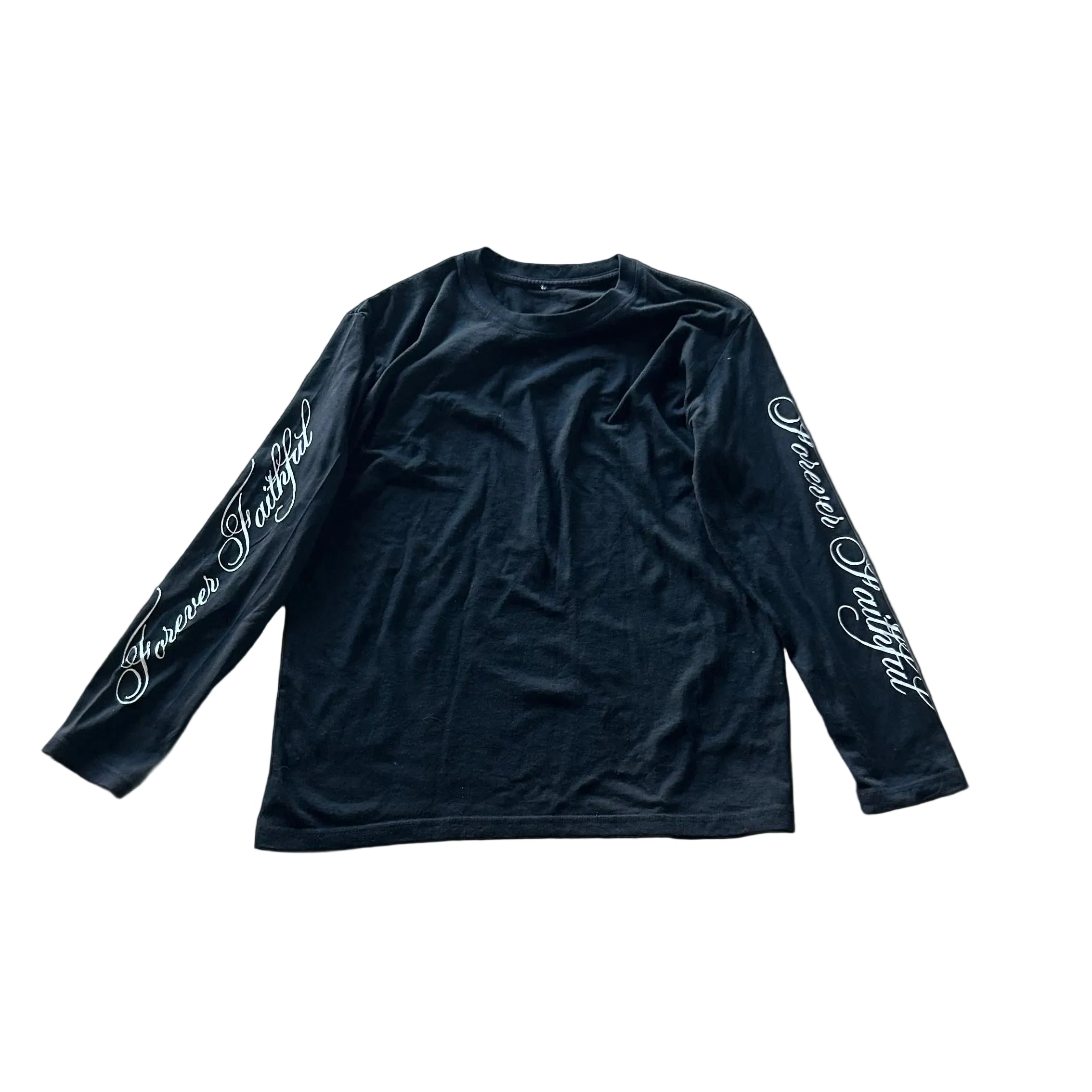 Black long-sleeve shirt with white text on a concrete floor